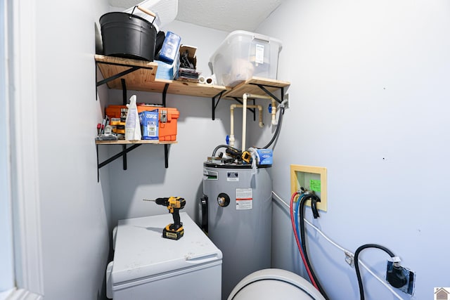 1715 State Route 80 W, Arlington, KY 42021 - utility room featuring electric water heater and washer / clothes dryer