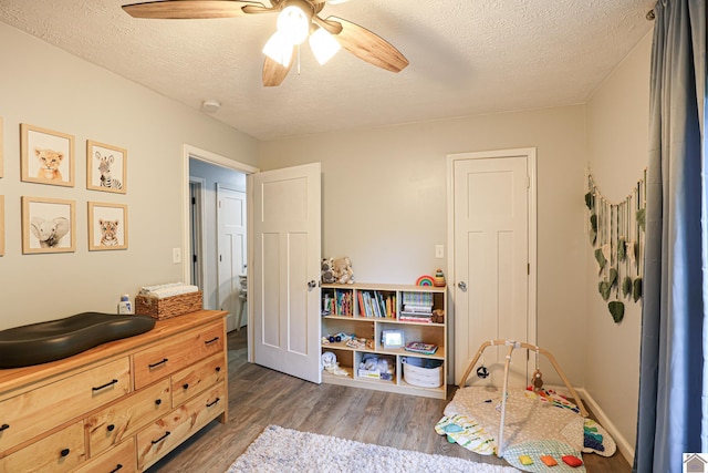 1715 State Route 80 W, Arlington, KY 42021 - bedroom with wood finished floors, a textured ceiling, and a ceiling fan