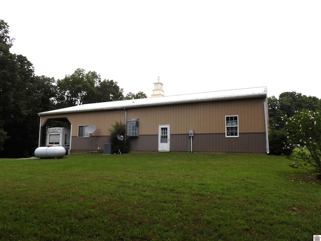 907 State Route 819 N, Kuttawa, KY 42055 - rear view of property with an outbuilding, a lawn, an outdoor structure, a chimney, and a metal roof