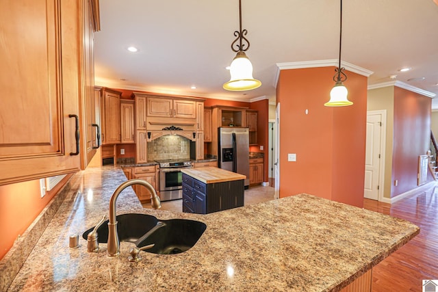 329 Royal Park Dr, Calvert City, KY 42029 - kitchen with appliances with stainless steel finishes, wooden counters, ornamental molding, backsplash, and a kitchen island