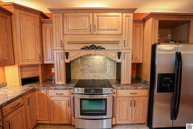 329 Royal Park Dr, Calvert City, KY 42029 - kitchen with appliances with stainless steel finishes, tasteful backsplash, dark stone countertops, and brown cabinetry