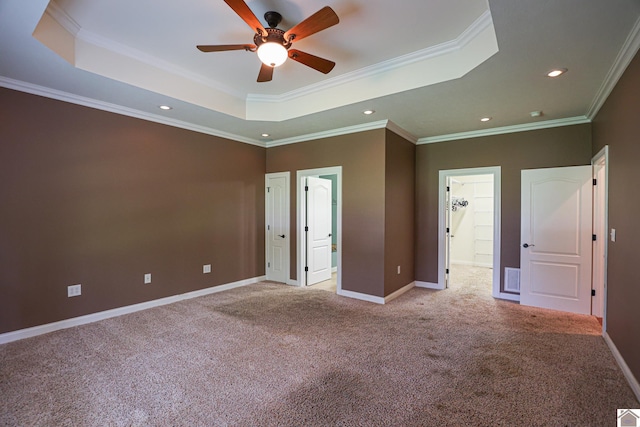 329 Royal Park Dr, Calvert City, KY 42029 - unfurnished bedroom with a tray ceiling, light colored carpet, recessed lighting, ornamental molding, and ensuite bathroom