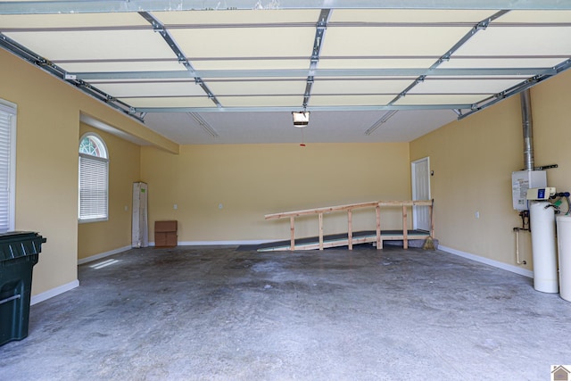 329 Royal Park Dr, Calvert City, KY 42029 - garage featuring a garage door opener and baseboards