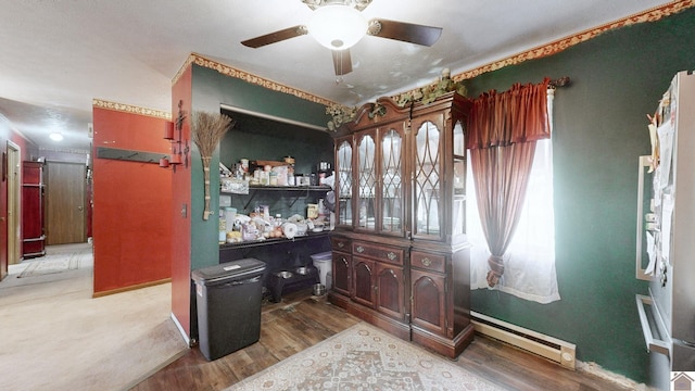 233 Bendefield Ln, Farmington, KY 42040 - bar with a baseboard radiator, a ceiling fan, and wood finished floors