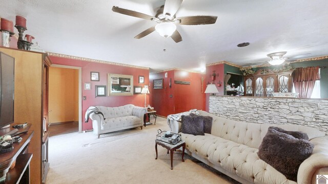 233 Bendefield Ln, Farmington, KY 42040 - living area featuring a ceiling fan, light colored carpet, and crown molding