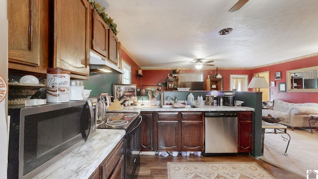 233 Bendefield Ln, Farmington, KY 42040 - kitchen featuring stainless steel appliances, ceiling fan, under cabinet range hood, a peninsula, and light countertops