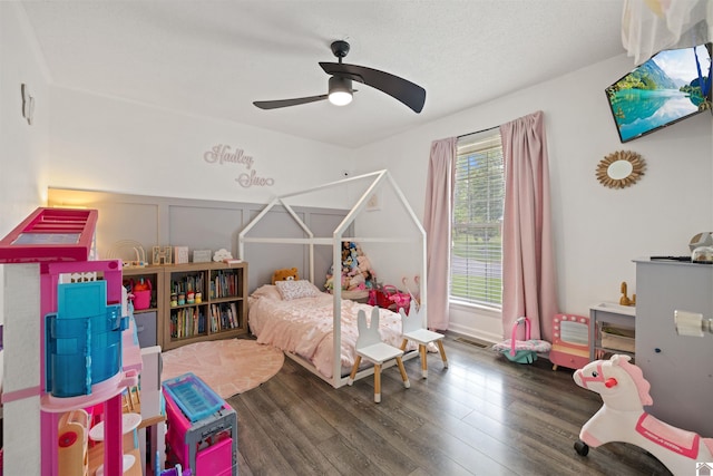 1333 Fairway Cir, Mayfield, KY 42066 - bedroom with wood finished floors, a ceiling fan, and a decorative wall