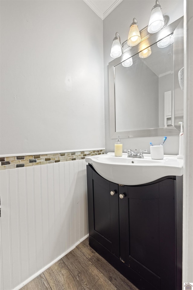 1333 Fairway Cir, Mayfield, KY 42066 - bathroom with crown molding, wood finished floors, vanity, radiator heating unit, and a wainscoted wall
