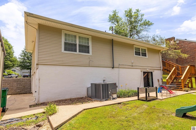1333 Fairway Cir, Mayfield, KY 42066 - back of property featuring stairs, stucco siding, a patio, and a wooden deck