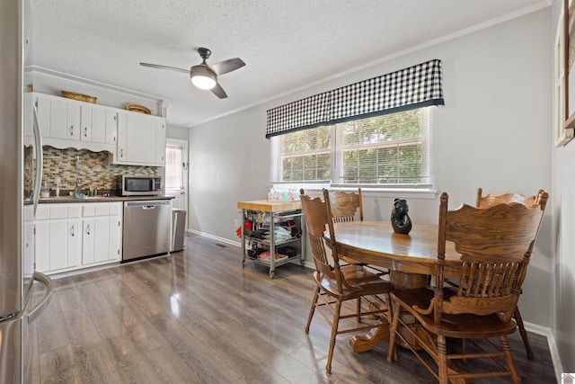 1333 Fairway Cir, Mayfield, KY 42066 - dining room with crown molding, ceiling fan, wood finished floors, and a textured ceiling
