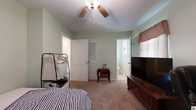 152 State Route 94 W, Sedalia, KY 42079 - bedroom featuring light carpet, ensuite bathroom, a textured ceiling, and ceiling fan