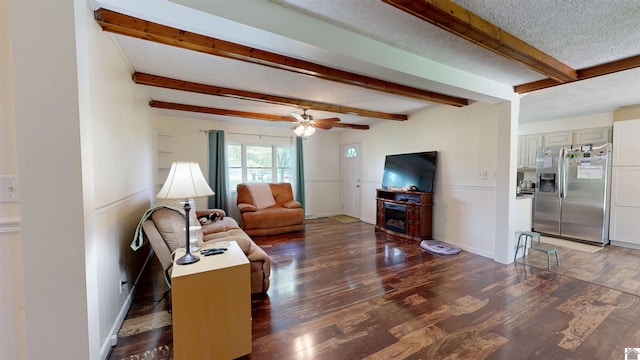 152 State Route 94 W, Sedalia, KY 42079 - living room with wood finished floors, beamed ceiling, a ceiling fan, and a fireplace