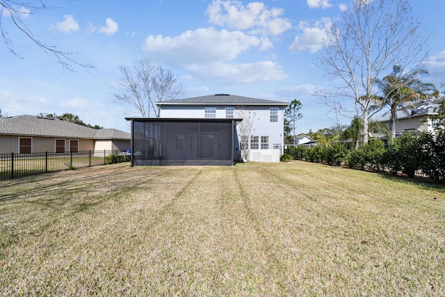 back of house featuring a sunroom and a yard