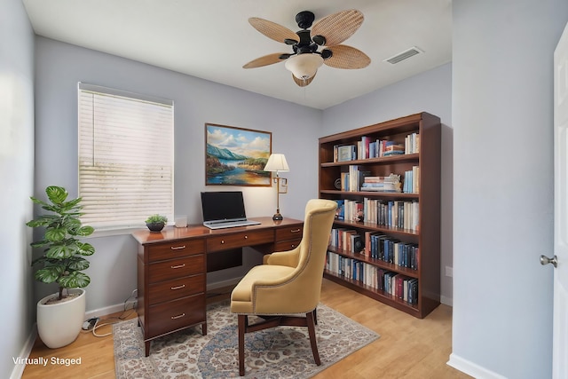 office space with ceiling fan and light hardwood / wood-style flooring