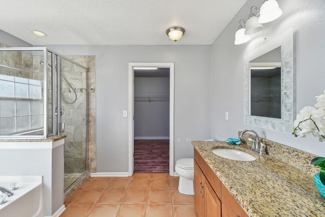 full bathroom with tile patterned flooring, shower with separate bathtub, and a textured ceiling