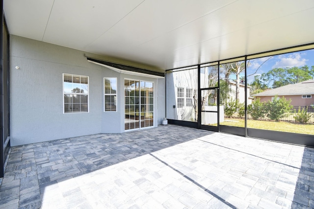 unfurnished sunroom with plenty of natural light