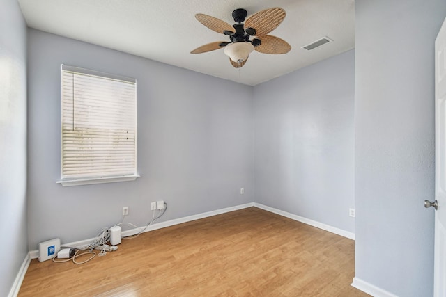 unfurnished room with ceiling fan and light wood-type flooring