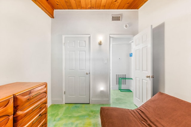 carpeted bedroom featuring wood ceiling