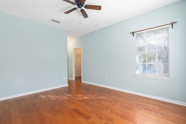 unfurnished room with hardwood / wood-style floors and ceiling fan