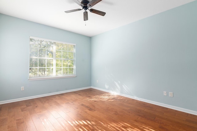 unfurnished room with wood-type flooring and ceiling fan