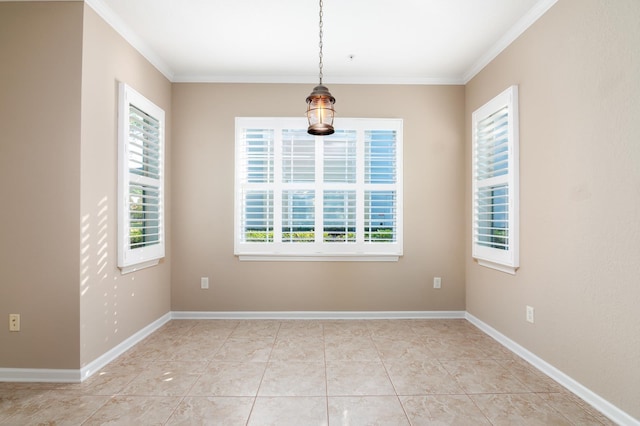 empty room featuring crown molding and light tile patterned floors