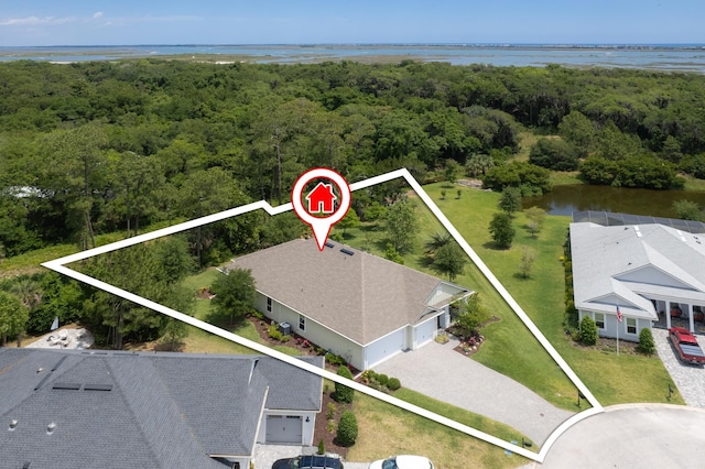 birds eye view of property with a water view