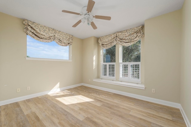 unfurnished room featuring light wood-type flooring and ceiling fan