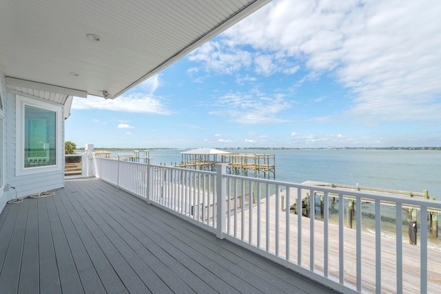 wooden deck featuring a water view