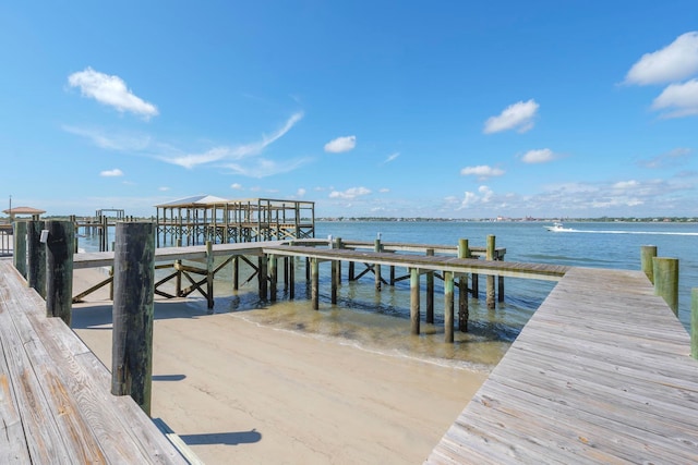 dock area with a water view