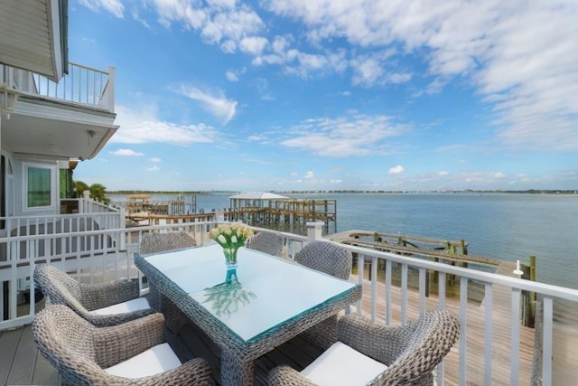 balcony featuring a water view