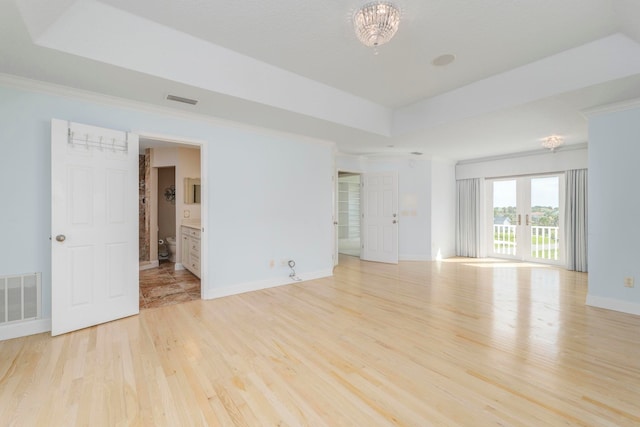 spare room featuring light hardwood / wood-style floors