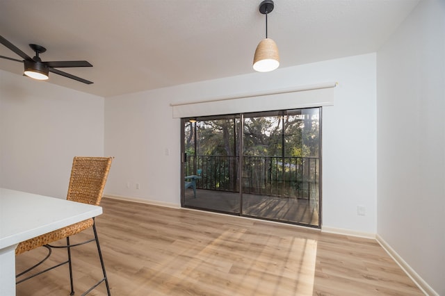 dining area featuring light hardwood / wood-style floors and ceiling fan