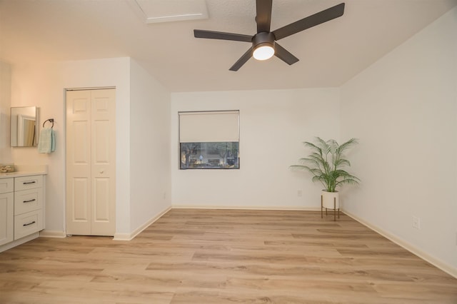 empty room featuring ceiling fan and light wood-type flooring