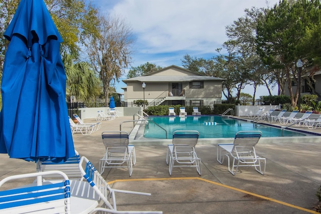 view of swimming pool with a patio