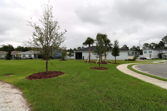 view of property's community with a lawn