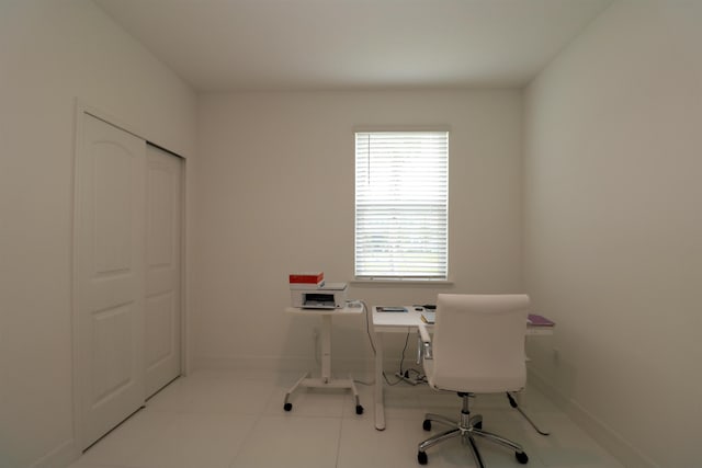 home office with light tile patterned floors