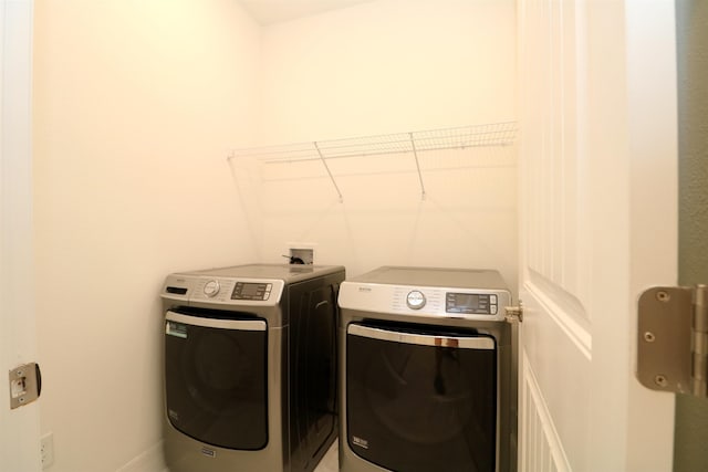 laundry room with washer and clothes dryer