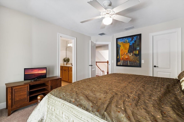 carpeted bedroom with connected bathroom and ceiling fan