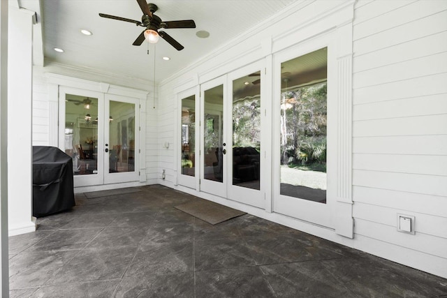 unfurnished sunroom with french doors and ceiling fan