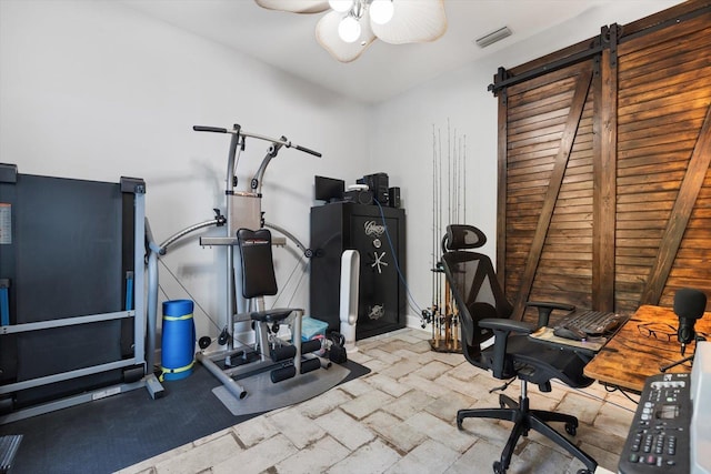 exercise area featuring ceiling fan