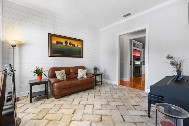 living area featuring ornamental molding