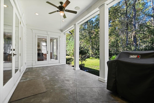 sunroom with ceiling fan and french doors