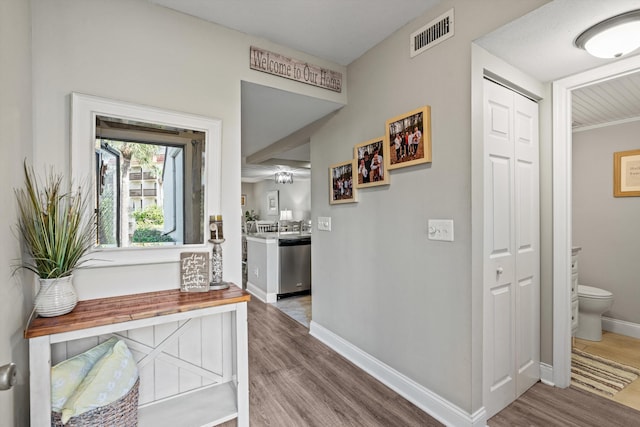 hall with hardwood / wood-style floors