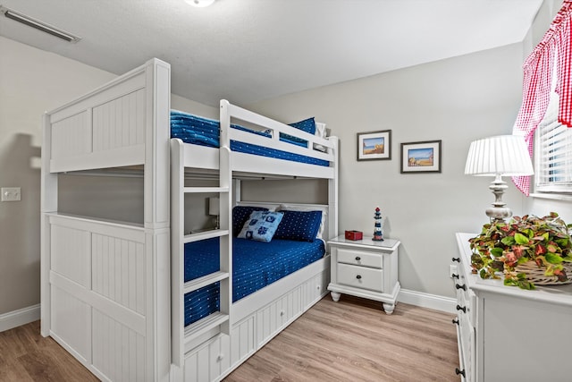 bedroom with light wood-type flooring