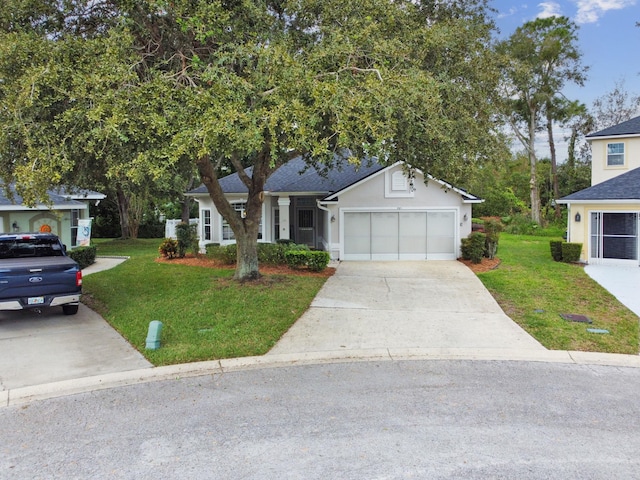 581 Boxwood Pl, Saint Augustine, FL 32086 - view of front of house featuring a front yard, concrete driveway, and an attached garage