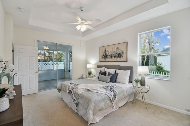 581 Boxwood Pl, Saint Augustine, FL 32086 - carpeted bedroom featuring a raised ceiling, access to outside, and a ceiling fan