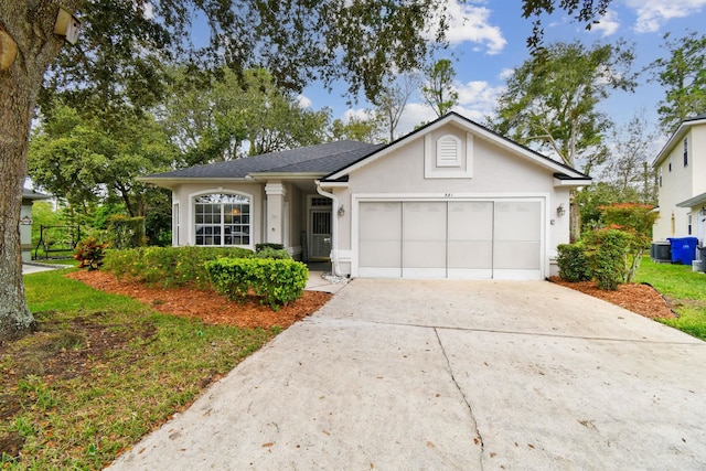 581 Boxwood Pl, Saint Augustine, FL 32086 - ranch-style home with stucco siding, an attached garage, concrete driveway, and roof with shingles