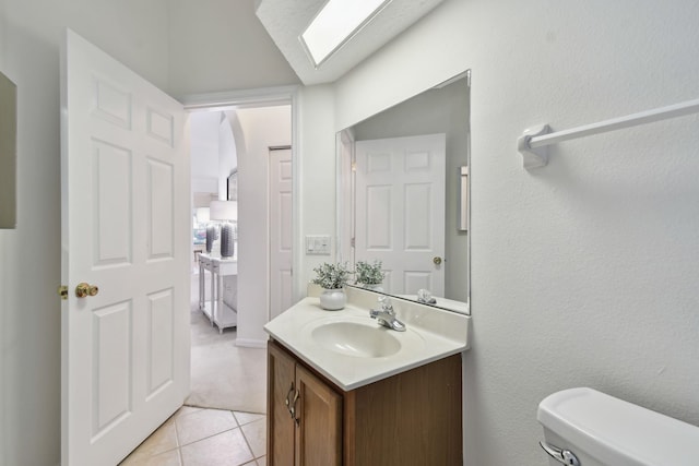 581 Boxwood Pl, Saint Augustine, FL 32086 - half bath featuring vanity, tile patterned floors, and a skylight