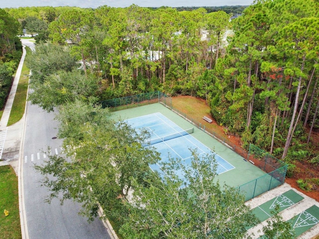 581 Boxwood Pl, Saint Augustine, FL 32086 - view of tennis court with shuffleboard and a forest view