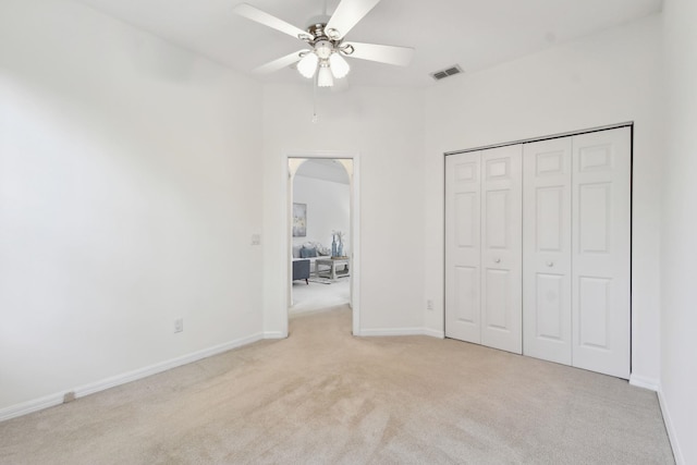 581 Boxwood Pl, Saint Augustine, FL 32086 - unfurnished bedroom with light colored carpet, ceiling fan, and a closet